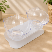 Gamelle double surélevée avec support antidérapant, bols en forme de tête de chat, support blanc, deux bols coloris transparent.
